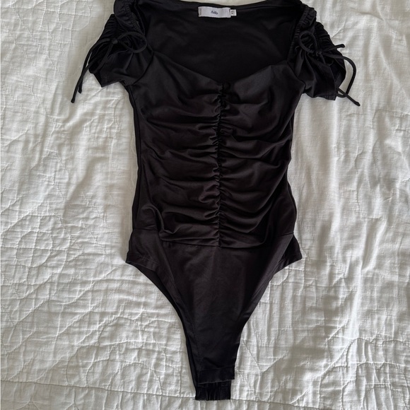 ADIKA Black Size XS short sleeve bodysuit with snap bottom and ruching - Picture 1 of 10